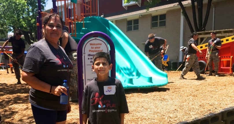 Zulema Rodriguez and her great grandson, Mike, admire the new playground built by Let's Play and the Dr. Pepper Snapple Group with help from KaBoom! and Prospera Housing.