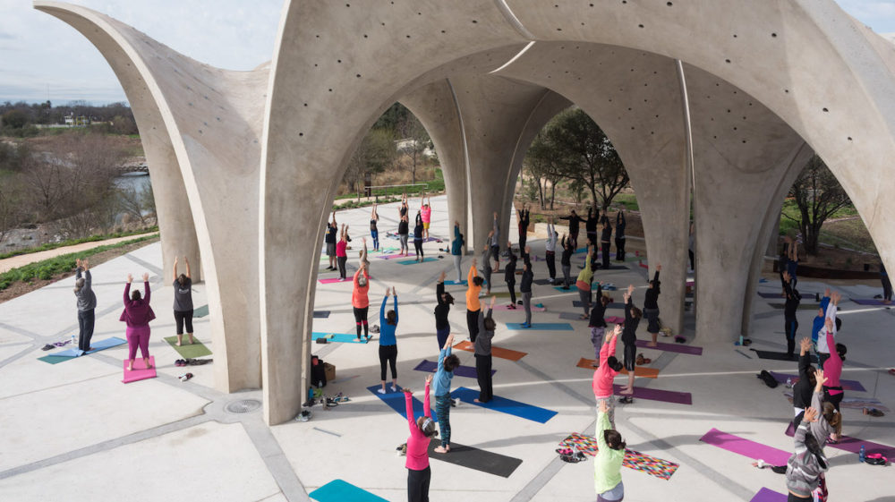 Individuals at free yoga class in confluence park